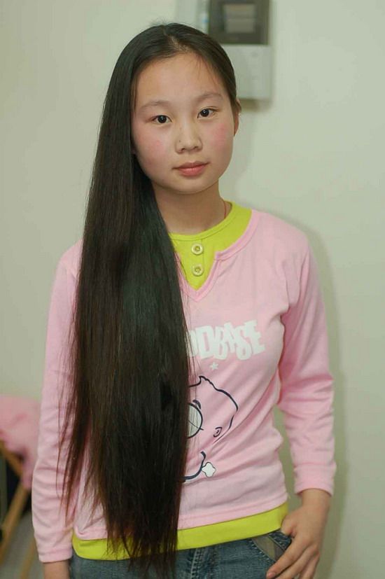 beautiful young girl cut long hair